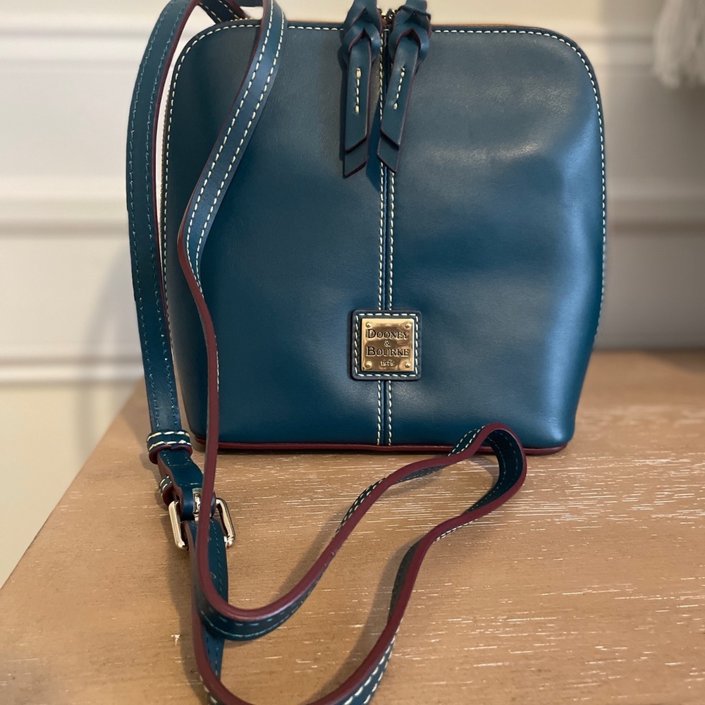 New. Never used. Dooney and Bourke Deep Teal Trixie Crossbody